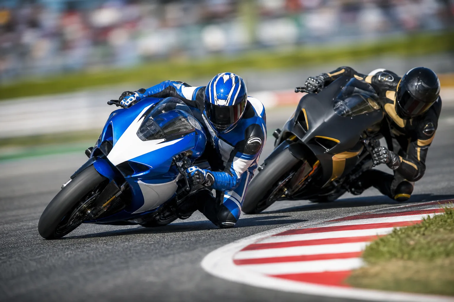 Two motorcycle racers leaning through a corner